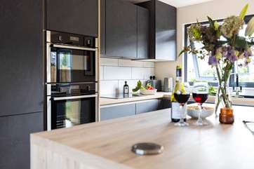 The fabulous open plan living space has a superb kitchen.
