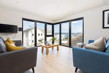 The gorgeous first floor living area has wonderful views from floor to ceiling windows.