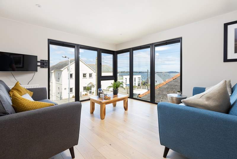 The gorgeous first floor living area has wonderful views from floor to ceiling windows.