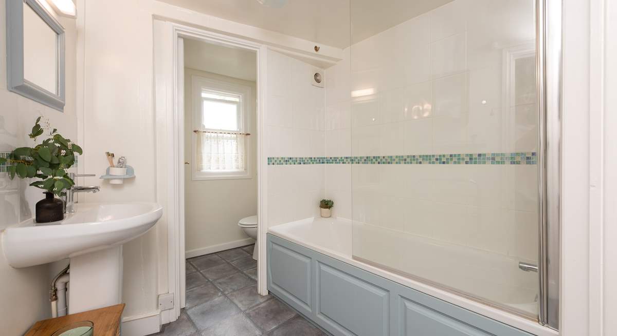 Unwind in the inviting bathtub after a day on the beach. The family bathroom is located on the first floor. 