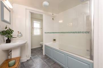 Unwind in the inviting bathtub after a day on the beach. The family bathroom is located on the first floor.