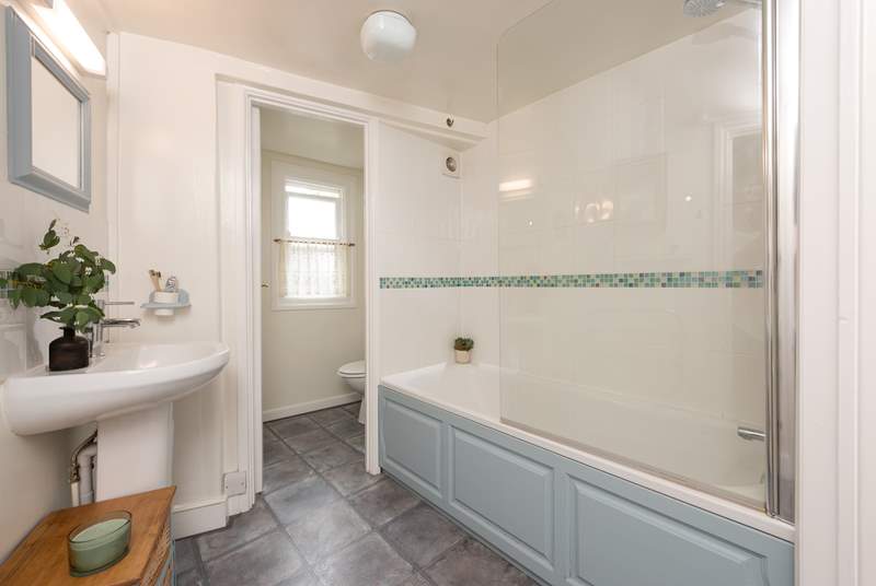Unwind in the inviting bathtub after a day on the beach. The family bathroom is located on the first floor. 