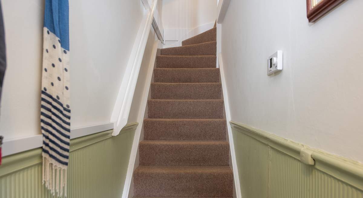 You'll be greeted by a small entrance hall and stairs up to the apartment.