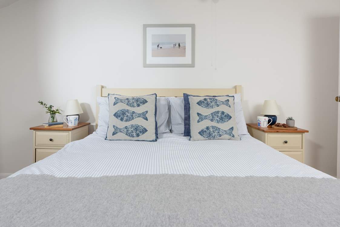 Bedroom one houses a luxurious king-size bed. Please note that there are steps leading into each bedroom and the landing has steps too!
