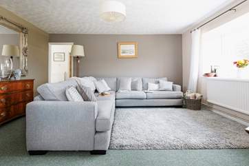 The lovely sitting-room looks out over rolling hills.