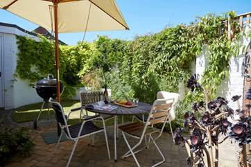 Sit and enjoy al fresco dining in the rear garden.