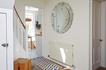 Statement furniture includes this fabulous mirror in the hallway.