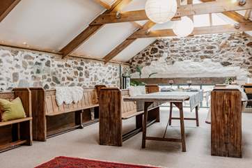 Pews and wooden beams complete the stunning dining-area.