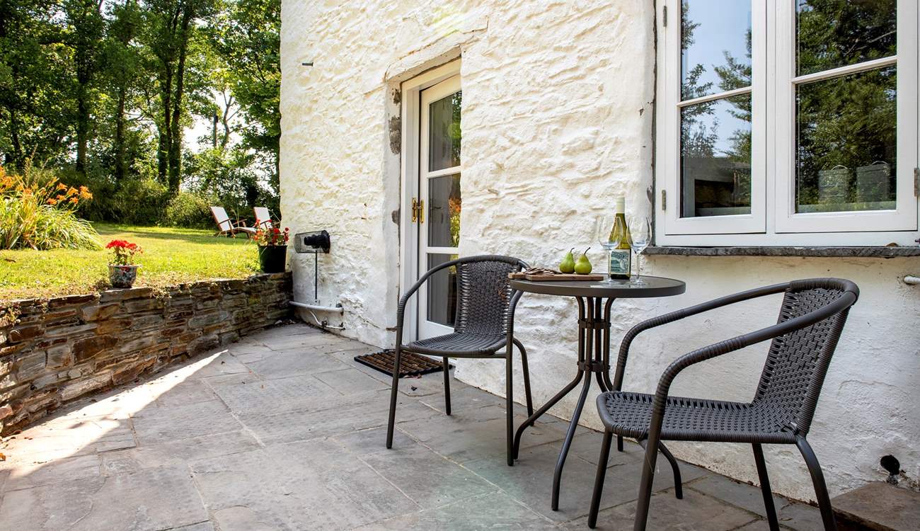 A bistro table outside the kitchen, perfect for a morning coffee or an evening tipple. 