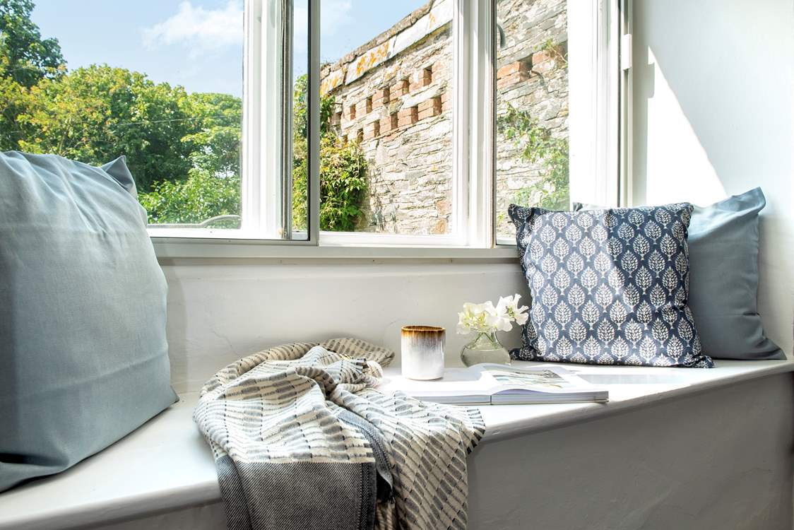 Take a pew on the window seat and relax with a good book.
