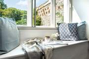 Take a pew on the window seat and relax with a good book.