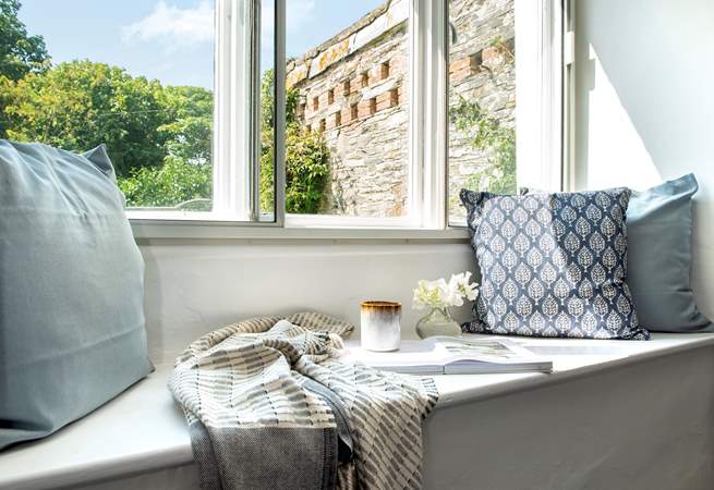 Take a pew on the window seat and relax with a good book.