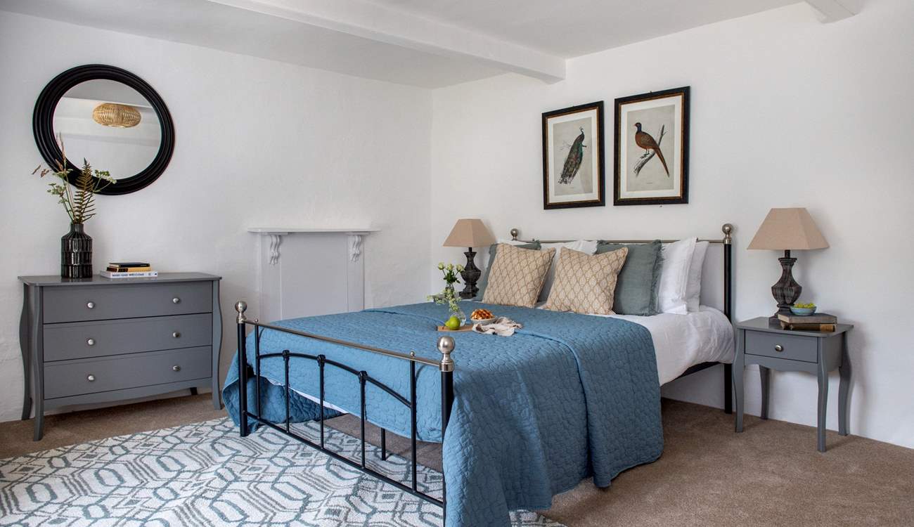 This dreamy bedroom has a king-size bed and gorgeous luxury linens.