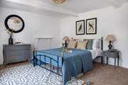 This dreamy bedroom has a king-size bed and gorgeous luxury linens.