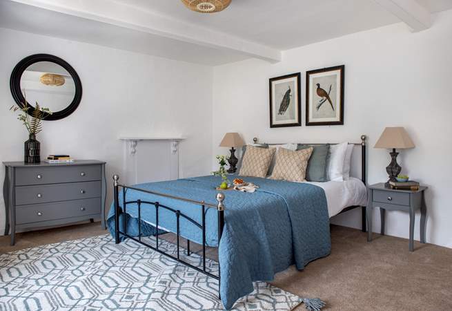This dreamy bedroom has a king-size bed and gorgeous luxury linens.