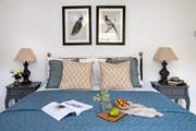 Relaxing tones and gorgeous bedding.