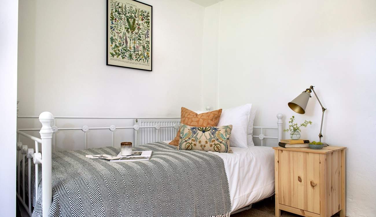 The pretty bed in bedroom 4.