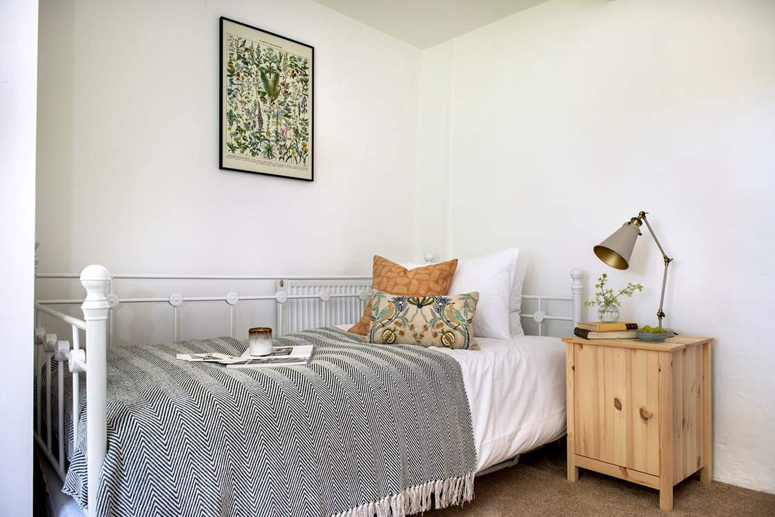 The pretty bed in bedroom 4.