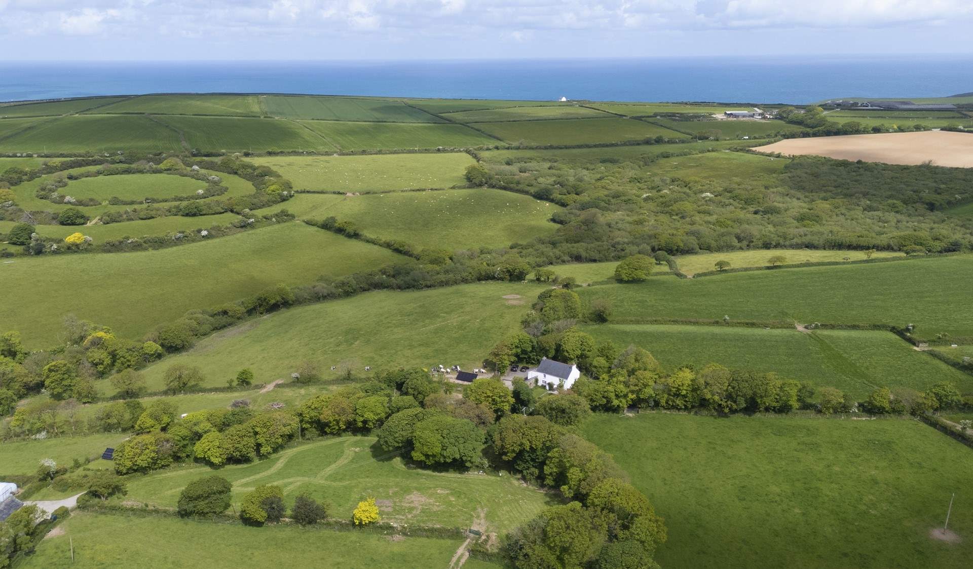 Nestled in the peace and tranquillity of the countryside , yet the coast is only a short distance away.