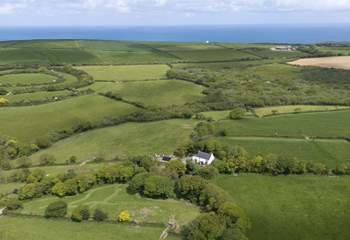 Nestled in the peace and tranquillity of the countryside , yet the coast is only a short distance away.