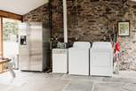 This space also hosts the shared kitchen space, with a kettle, toaster, fridge/freezer, washing machine and tumble-dryer.