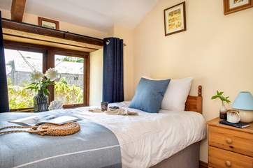 Bedroom three is kept light and airy by its wonderful window.