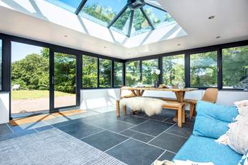 Relax with a cup of coffee and enjoy panoramic views across the garden.