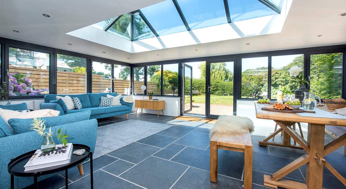 The stunning contemporary living space has an amazing apex roof window, perfect for star gazing. 