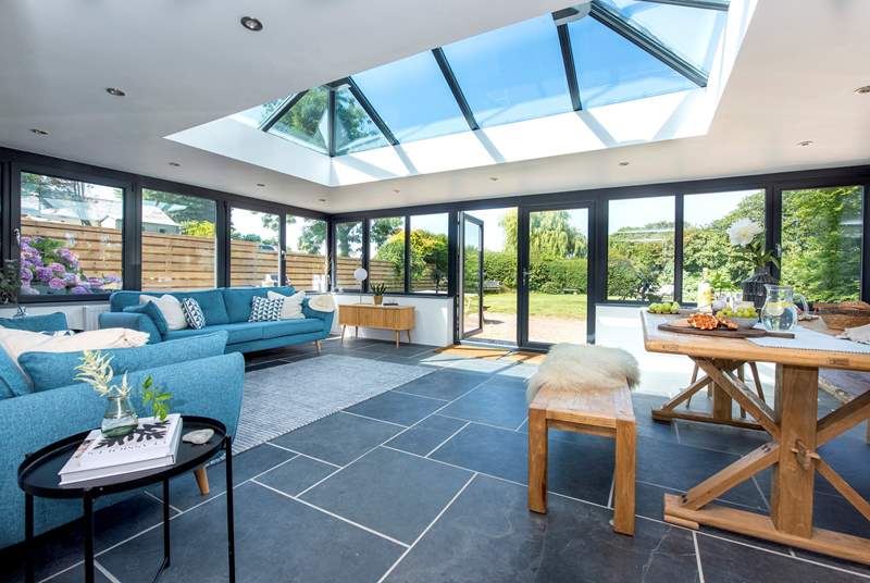 The stunning contemporary living space has an amazing apex roof window, perfect for star gazing. 