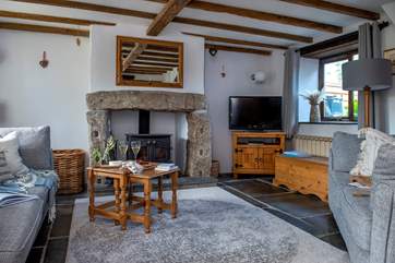 The snug sitting-room is perfect for relaxing nights in.