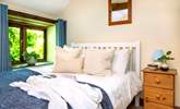 Snuggle up on bedroom two's double bed after a busy day. - Thumbnail Image