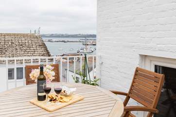 Enjoy a spot of al fresco dining at the wooden dining area.