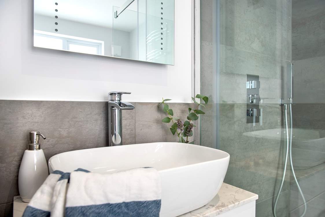Bedroom one has a stylish en suite...