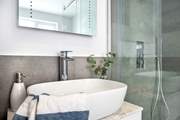 Bedroom one has a stylish en suite...