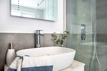 Bedroom one has a stylish en suite...