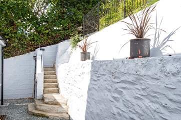 From the back door, 30 steps lead you up to the higher parking area.