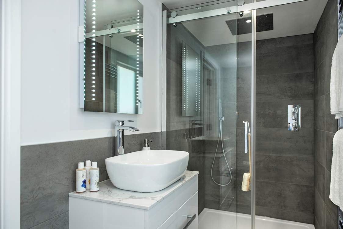 The second bedroom has an en suite shower-room. The super drench head shower will certainly set you up for the day.