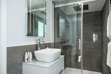 The second bedroom has an en suite shower-room. The super drench head shower will certainly set you up for the day.