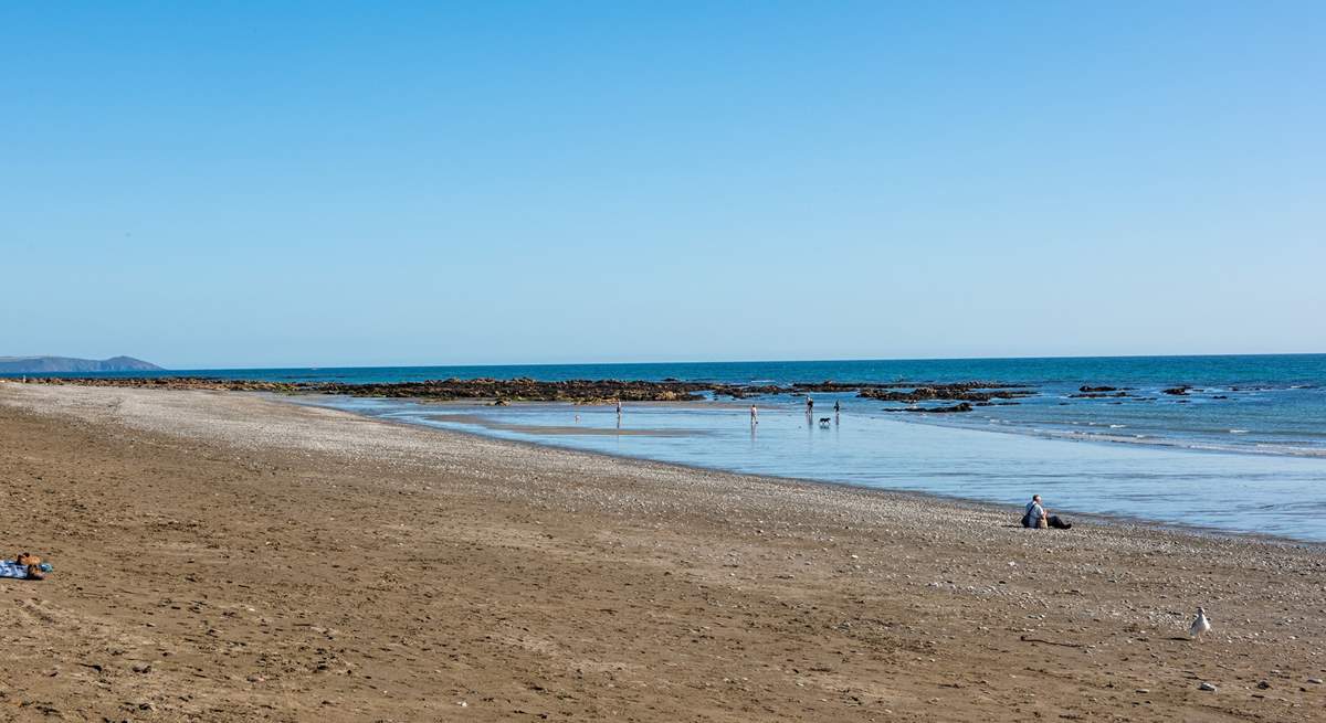 The beach at Seaton, when the tide is out you can walk all the way along the headland to Rame Head.