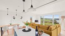 The stylish open plan living space has wonderful views of the River Dart.
