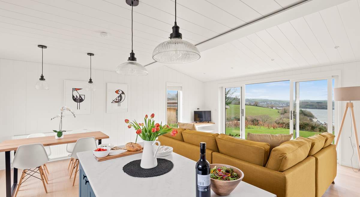 The stylish open plan living space has wonderful views of the River Dart.