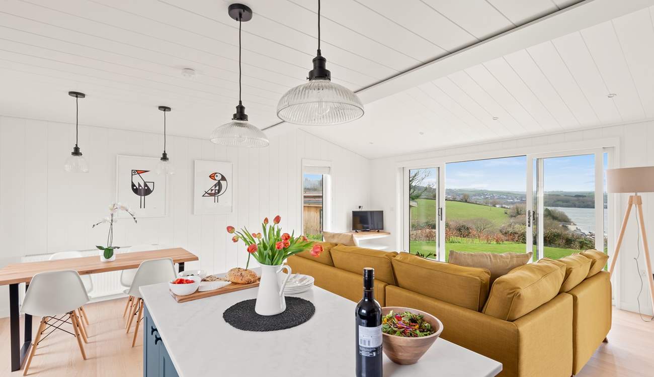 The stylish open plan living space has wonderful views of the River Dart.