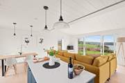 The stylish open plan living space has wonderful views of the River Dart.