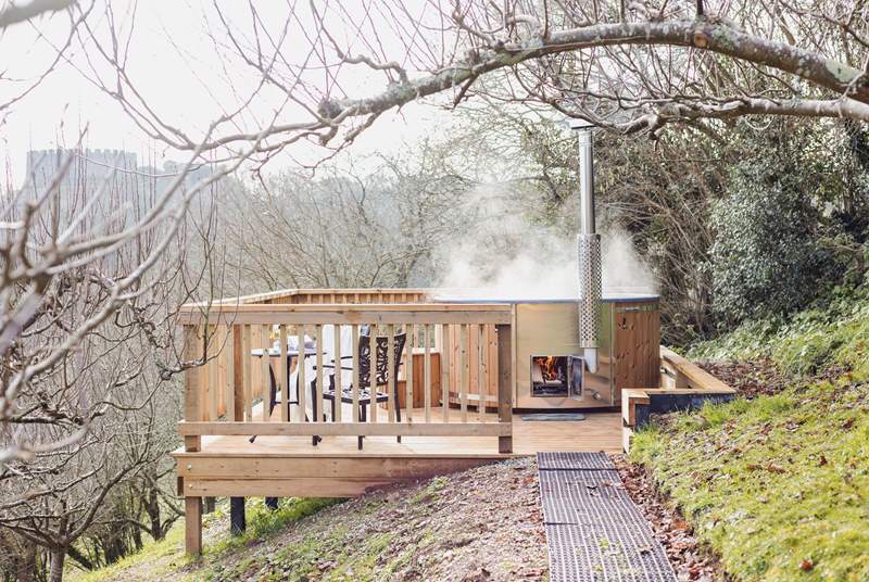 The hot tub can be found a short walk from the house allowing the platform to capitalise on the views from the log fired hot tub.