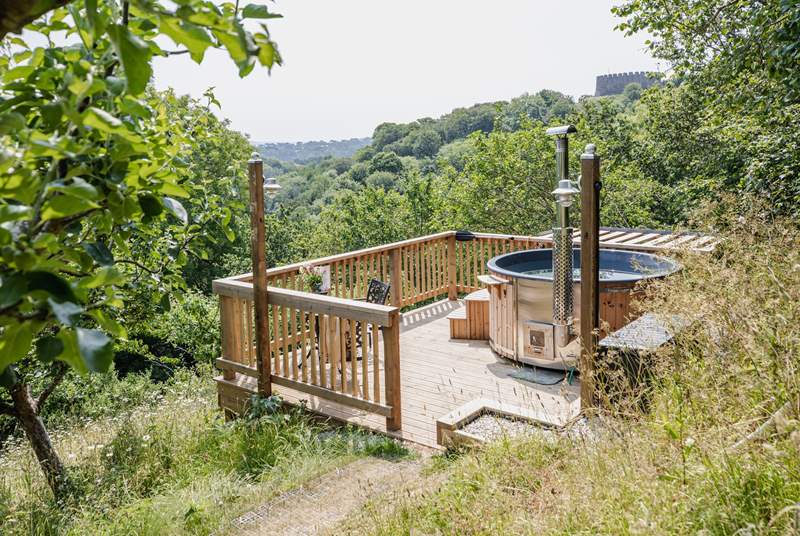Head down through the garden to the hot tub platform and soak in the views.