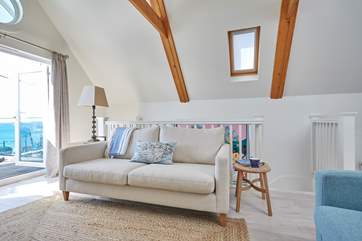 After a busy day on the beach, relax on the comfy sofa and watch a movie on the Smart TV.
