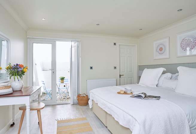 The gorgeous main bedroom (two) on the ground floor has an en suite shower-room and a secluded courtyard, perfect for two.
