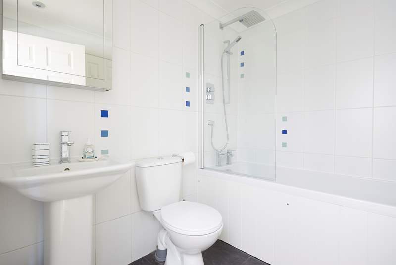 The bathroom can be accessed from either bedroom one or the ground floor hallway.