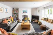 The sitting/dining-room is beautifully furnished.
