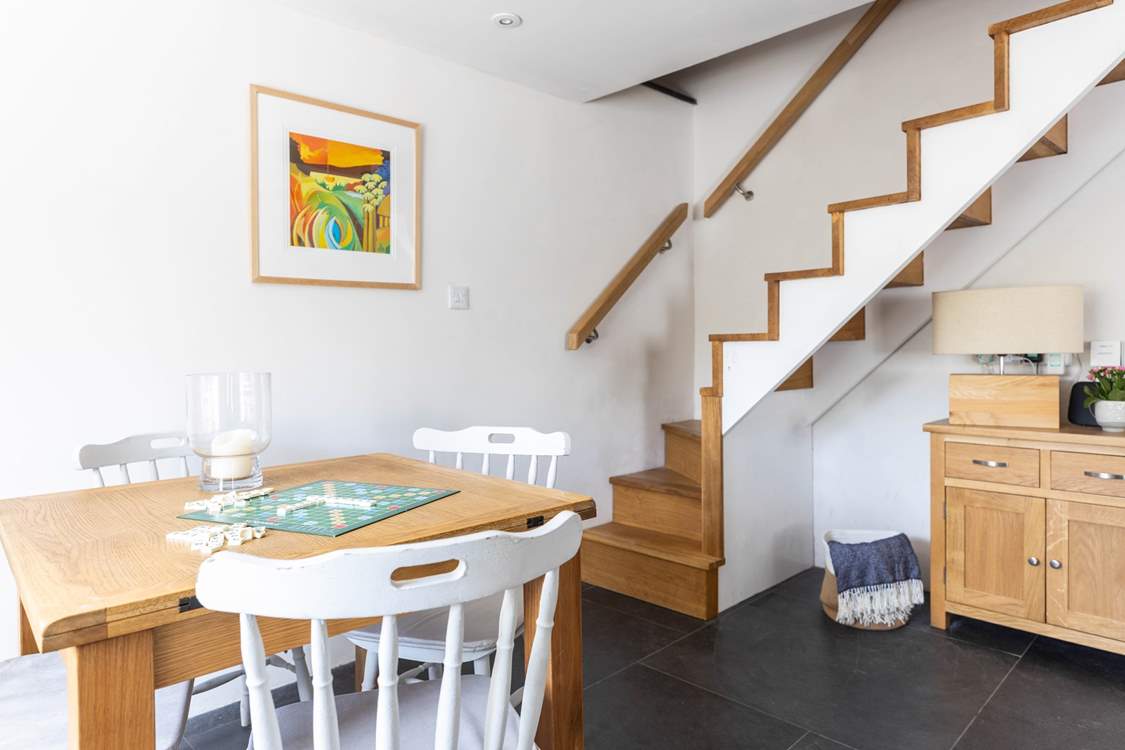The turning staircase leads from the sitting/dining-room.